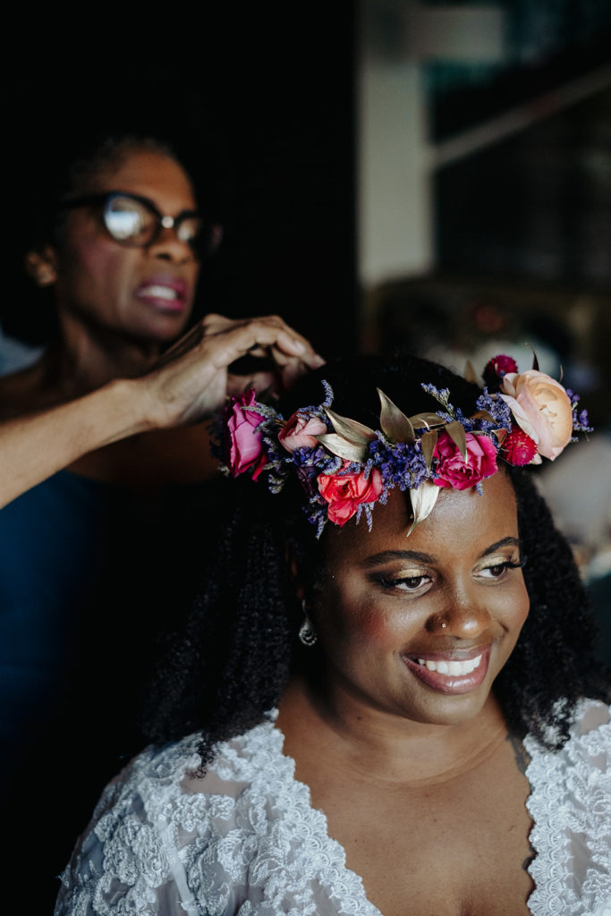 Mother of the bride putting on flower crown
