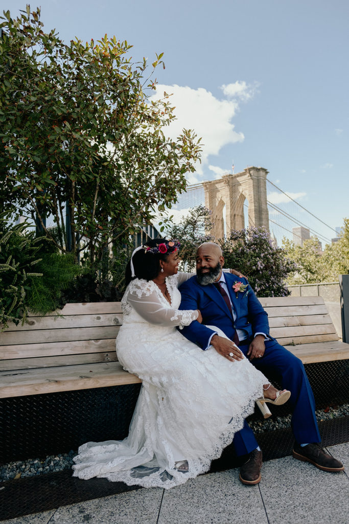 Bride and groom in front of Brooklyn Bridge