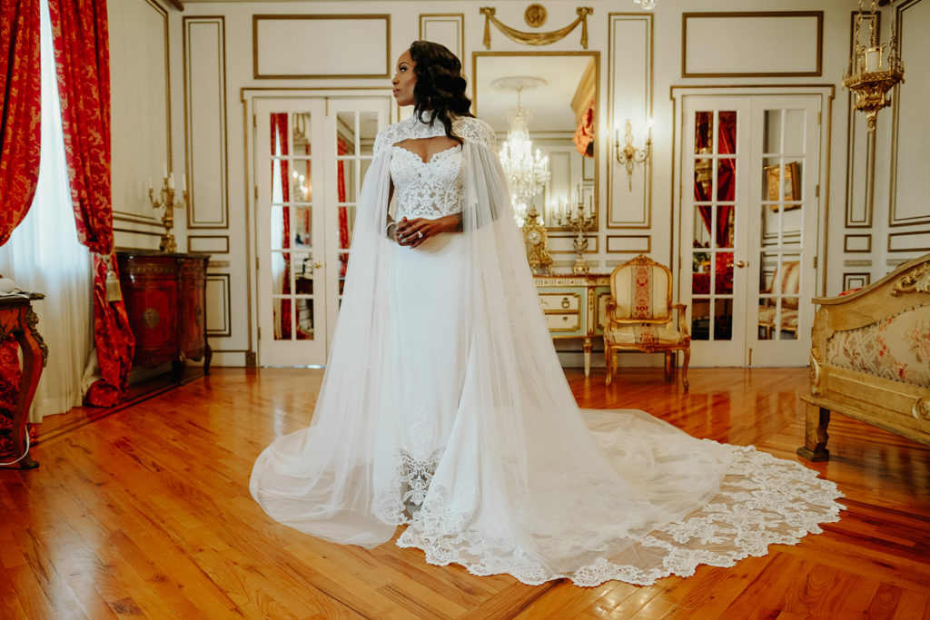 Bridal portrait of tattooed bride in Calla Blanche Wedding Dress and Cape at James Ward Mansion
