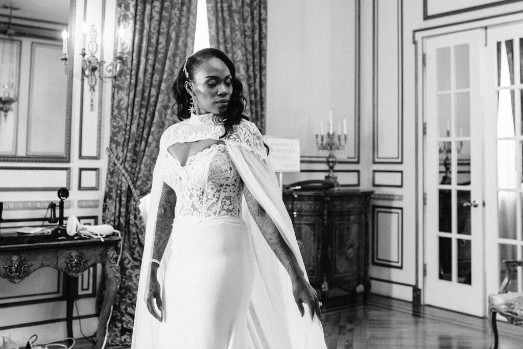 Bridal portrait of tattooed bride in Calla Blanche Wedding Dress and Cape at James Ward Mansion
