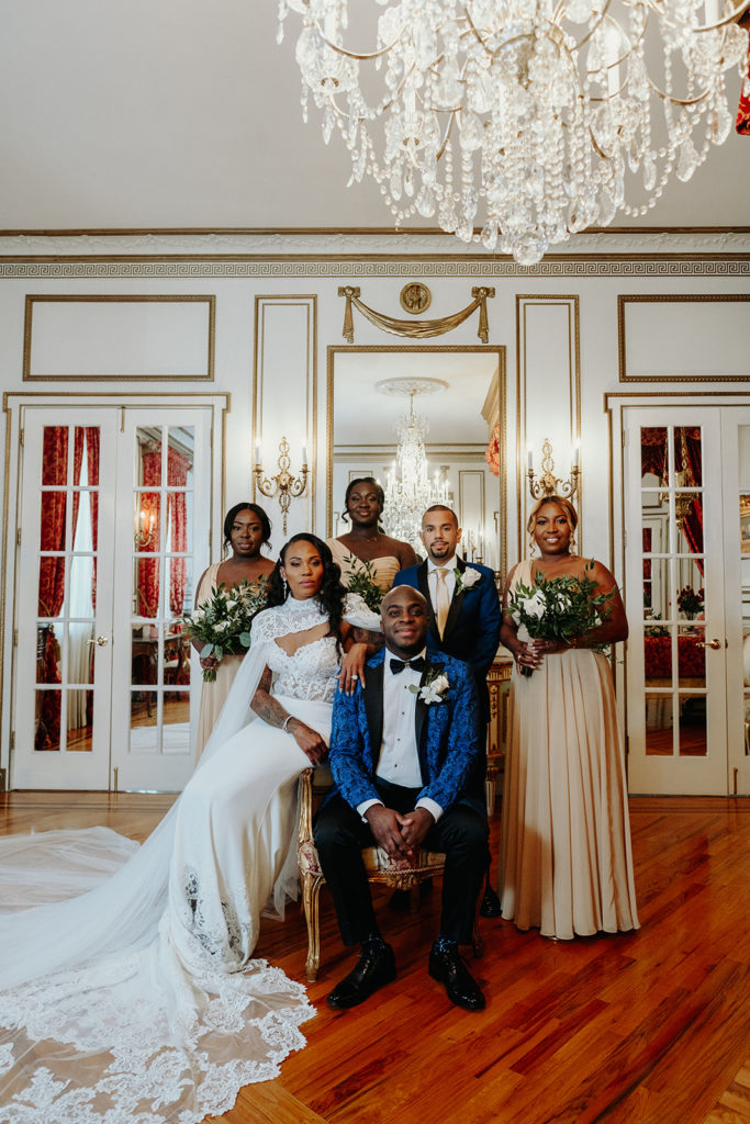 Bride and Groom Pose with Bridal Party for Portrait at James Ward Mansion
