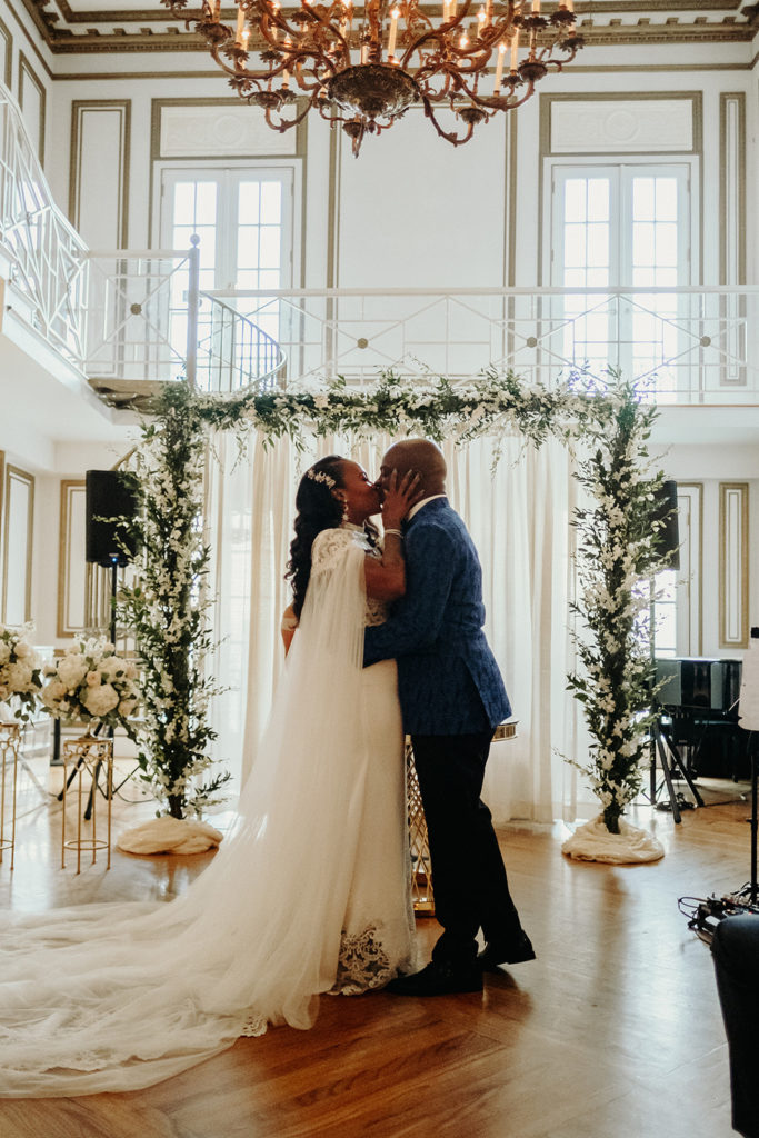 Bride and Groom's First Kiss during ceremony at James Ward Mansion Wedding