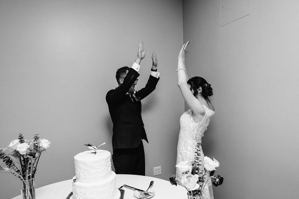Bride and Groom cut cake during reception at southwick's zoo mendon ma wedding