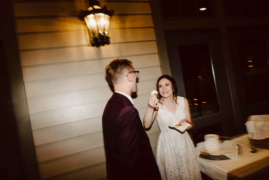 Bride and groom make s'mores during Reception at Southwick's Zoo Mendon MA Wedding