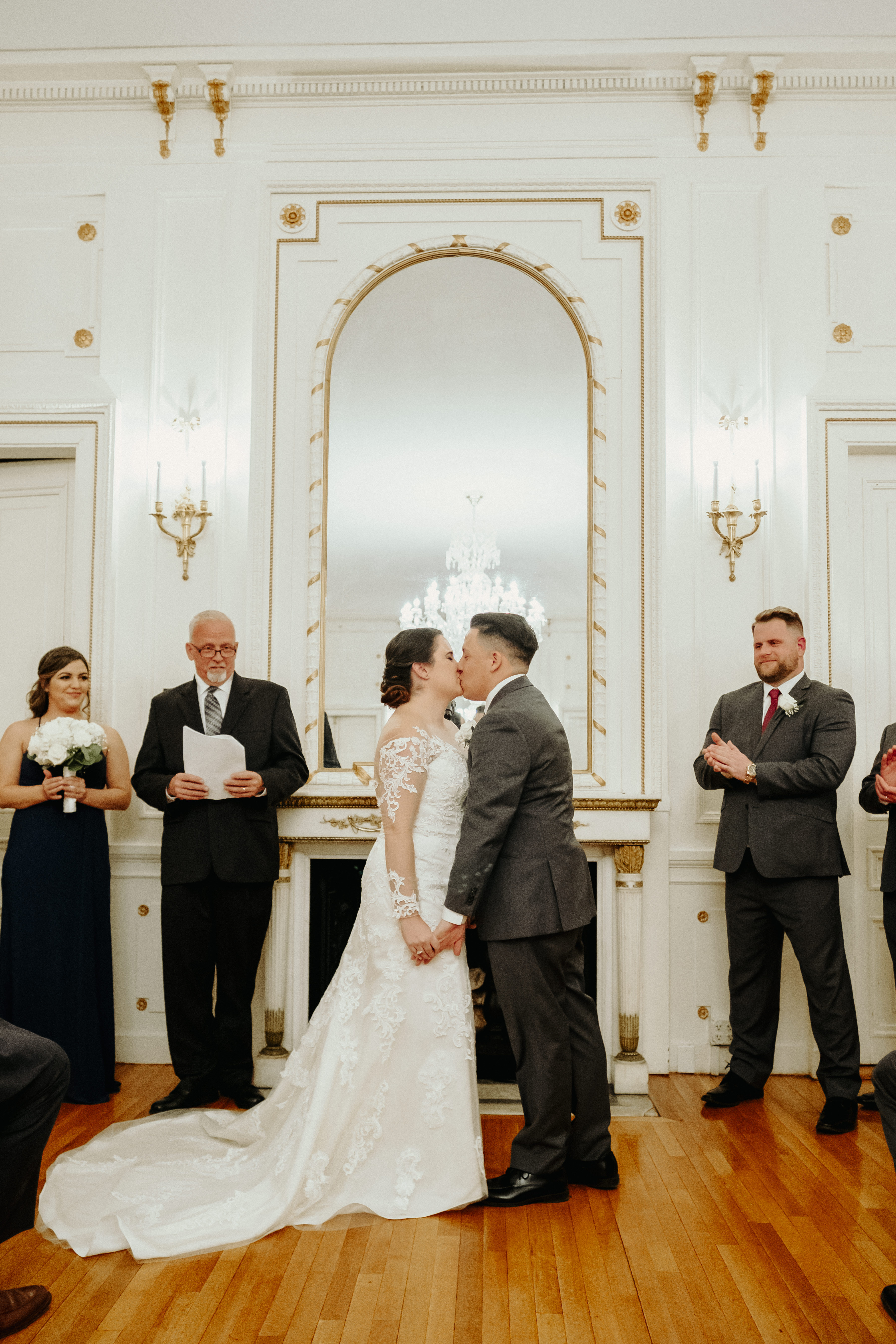 Bride and groom first kiss at Tupper Manor wedding