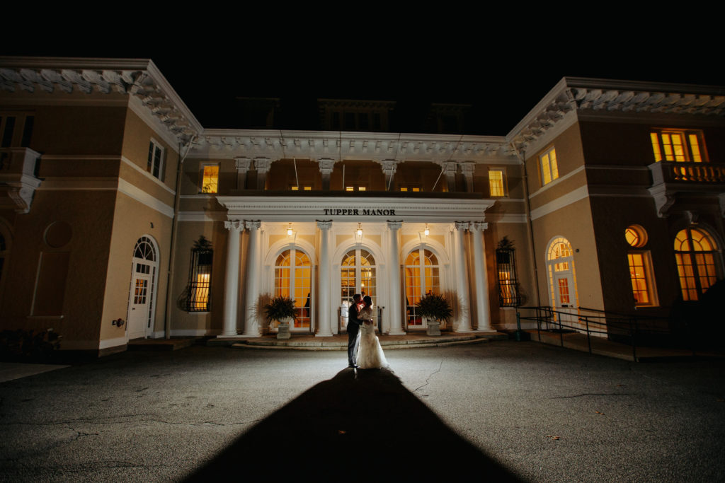 Bride and Groom Silhouette against the exterior of Tupper Manor Wedding