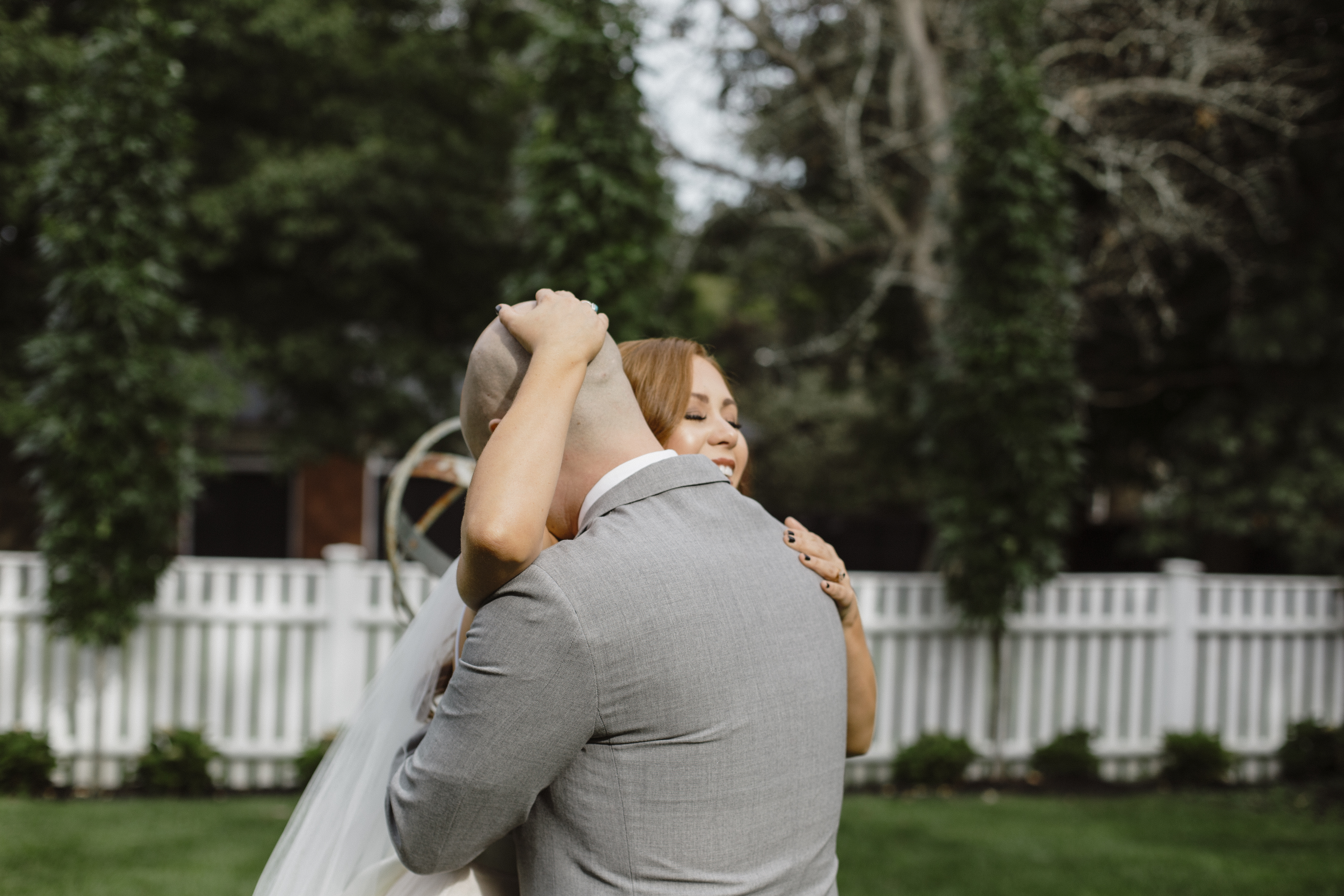 Bride and Groom Hug during First Look at Salem Massachusetts Wedding