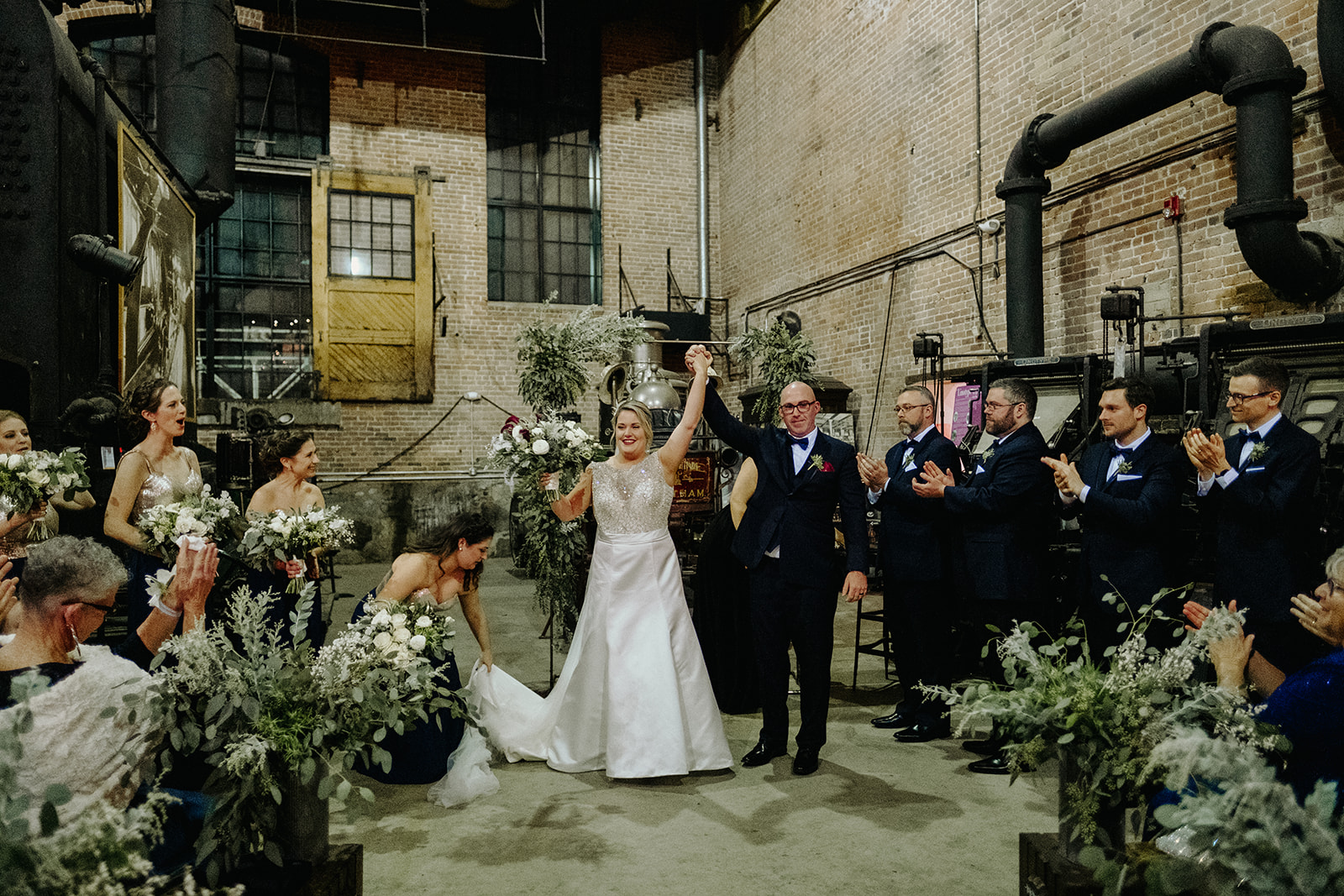 Bride and groom celebrate during the recessional at Charles River Museum of Industry Wedding
