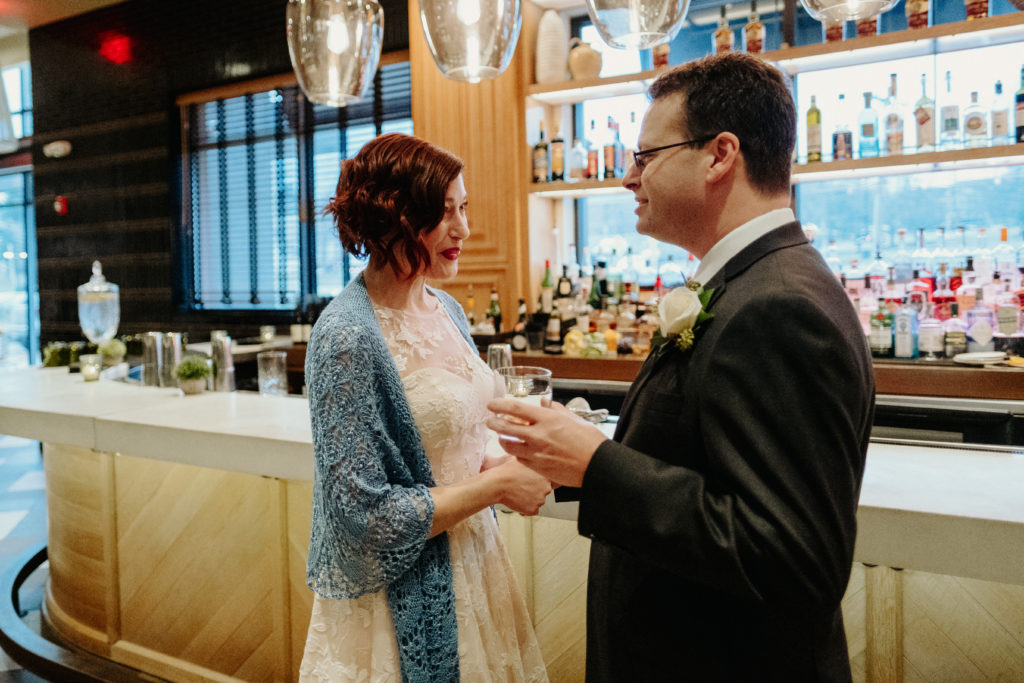 Bride and Groom first look at the bar at Osteria Posto, Boston Wedding Photographer