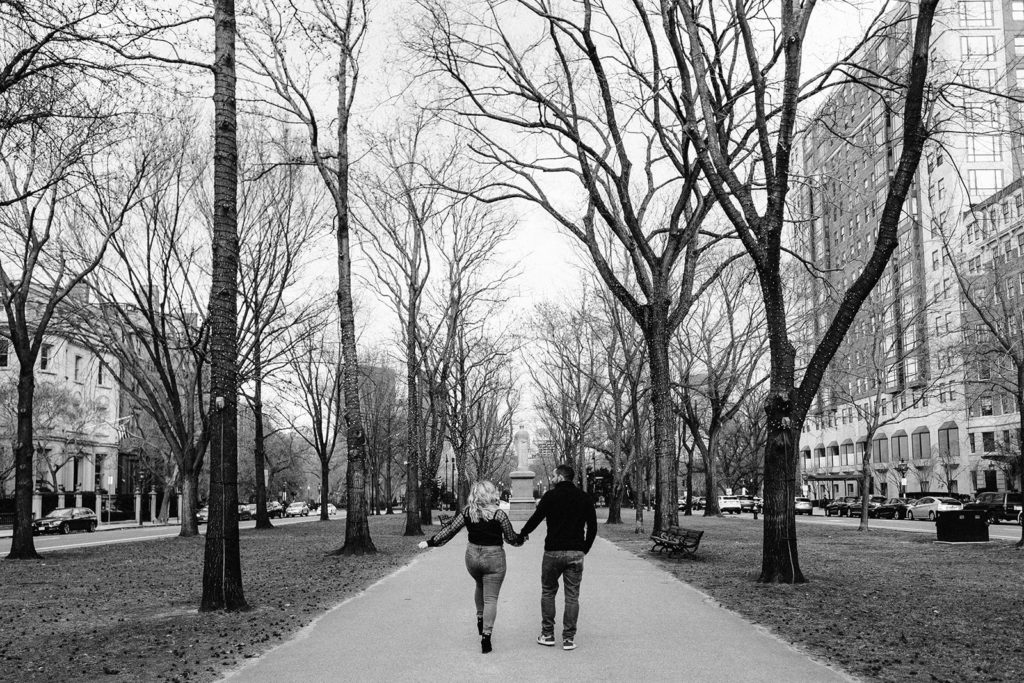 Couple walk on Commonwealth Ave Mall in Boston