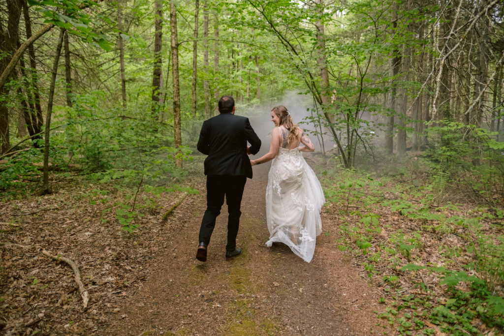 Tattooed Bride wearing boho wedding dress from David's Bridal and Groom pose during their central connecticut elopement with black smokebomb
