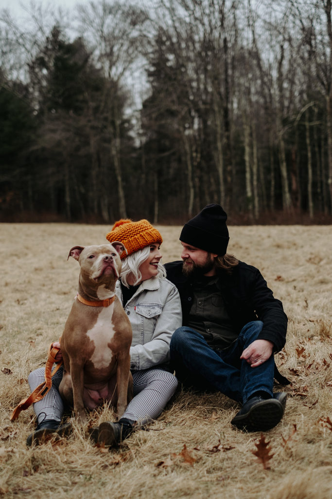 Couple with their Pit Bull pose for portrait during Borderland State Park Engagement Session | Boston Wedding Photographer