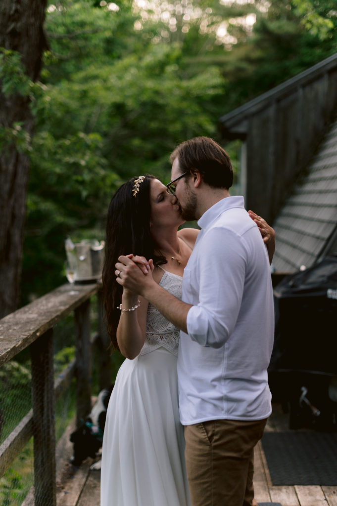 Bride and groom share first dance during elopement at cabin in Berkshires