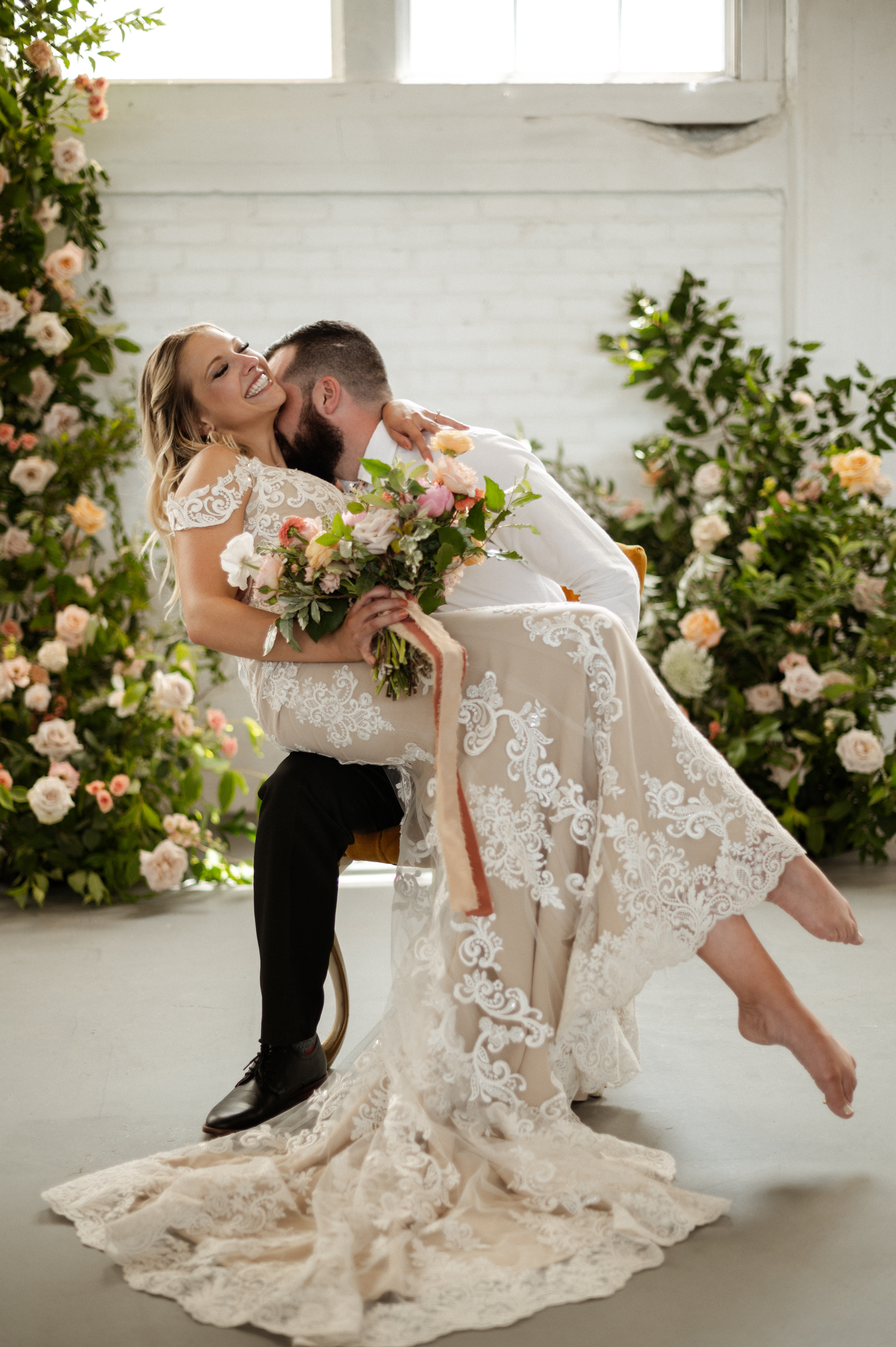 Boho Bride and groom infront of beautiful floral installation for Boho Styled Elopement