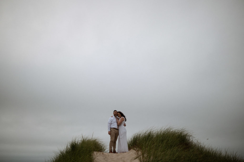 Bride and groom on sand dunes at Crosby Landing Beach in Cape Cod Massachusetts Minimony Elopement
