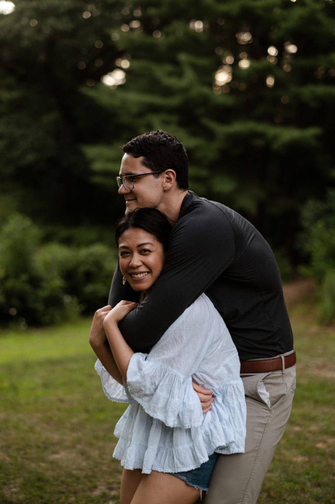 Couple Twirls during engagement session at Stonehurst Estate in Waltham, MA