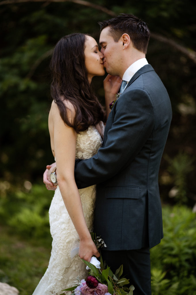 Bride and groom embrace during backyard Microwedding in Berkshires New York