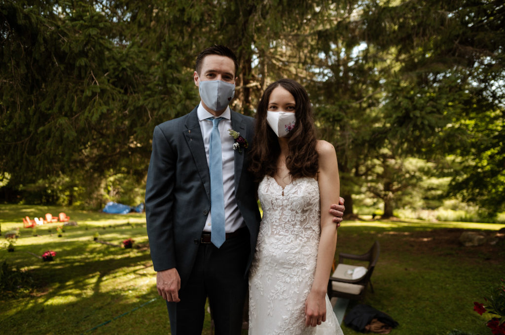 Bride and groom wearing facemasks during their COVID19 Microwedding in Upstate New York Berkshires