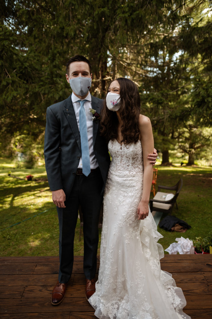 Bride and groom wearing facemasks during their COVID19 Microwedding in Upstate New York Berkshires