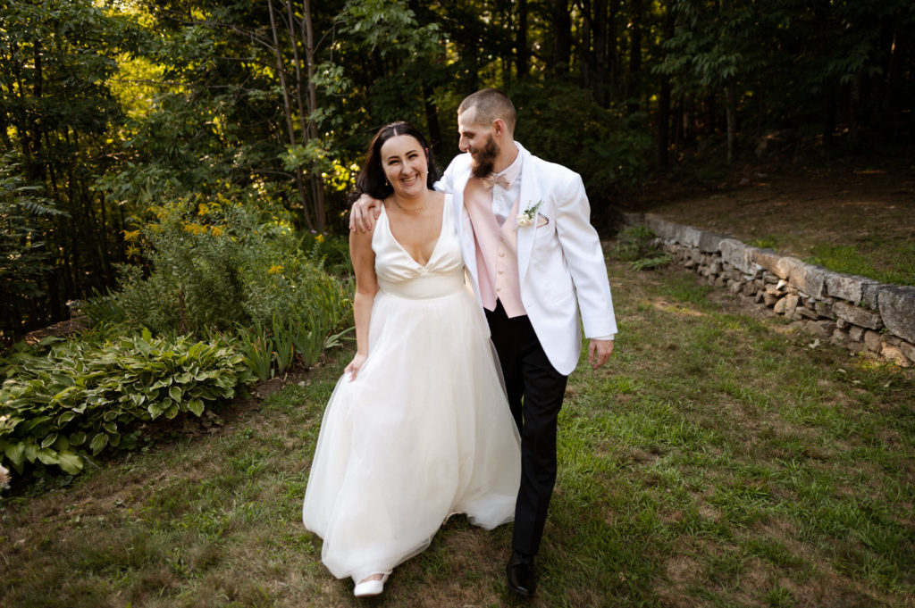 Bride and groom walk together in White Mountains New Hampshire Wedding
