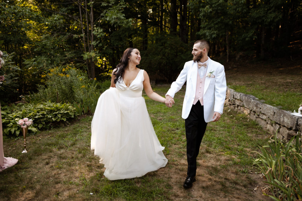 Bride and groom walk together in White Mountains New Hampshire Wedding