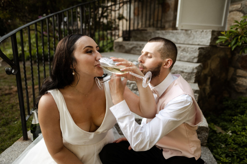 Bride and groom drink champagne together New Hampshire Microwedding