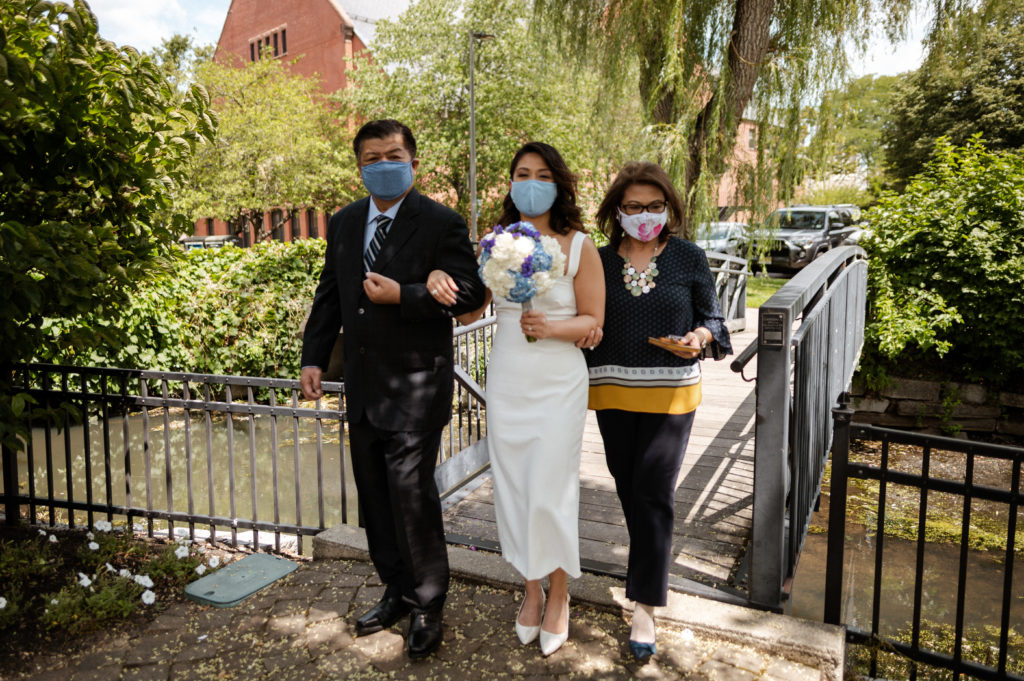 Bride walks down aisle wearing face mask during covid 19 wedding boston minimony