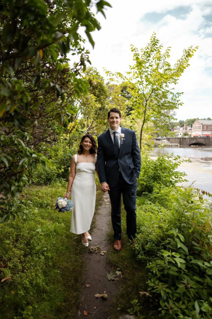 Chic bride wearing Floravere dress and groom in suit during Winchester Minimony in Boston MA