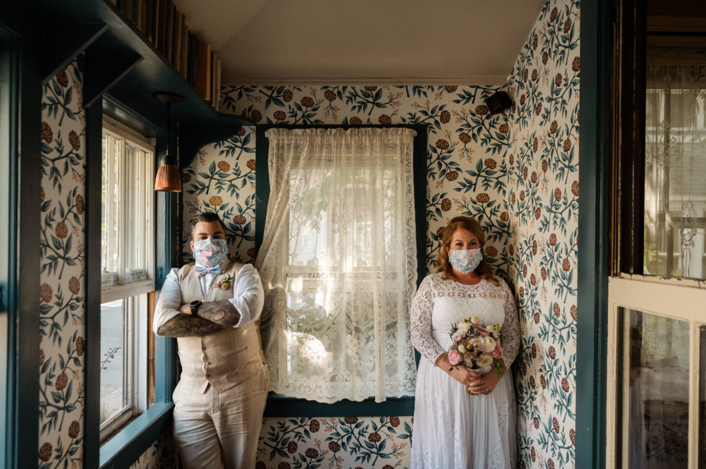 Bride and groom wedding portraits at the Sweet Life Cafe in Oak Bluffs on Martha's Vineyard - Couple wears matching COVID face masks