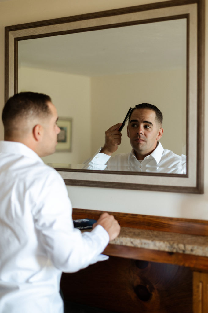 Groom getting ready for wedding at the Lighthouse Inn on Cape Cod