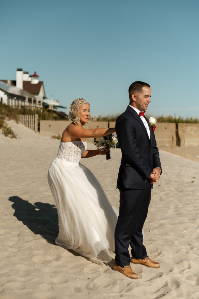 Bride and groom first look on the beach at West Dennis for wedding at The Lighthouse Inn on Cape Cod