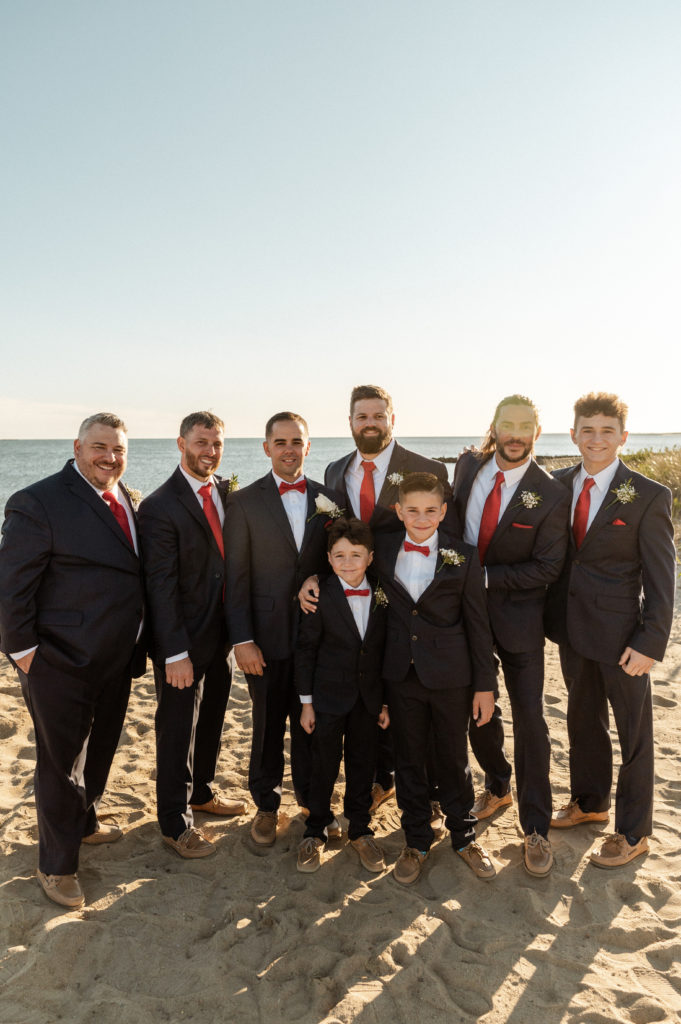 Groom and groomsmen in Navy suits at wedding at the Lighthouse Inn on Cape Cod