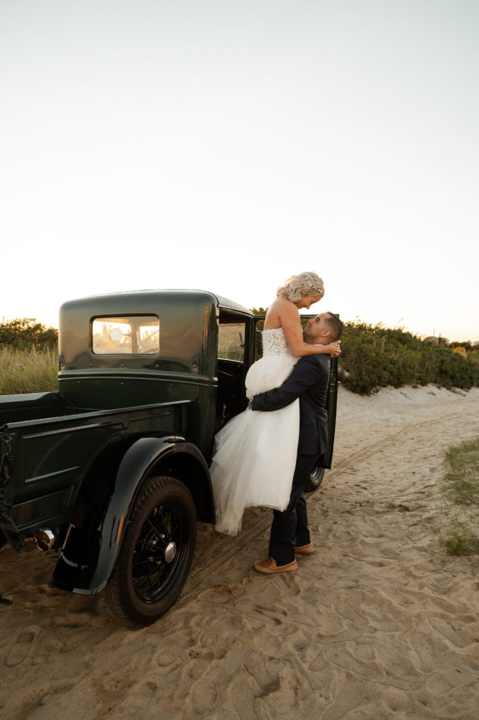 Bride and groom sunset portraits with vintage truck at the Lighthouse Inn Cape Cod