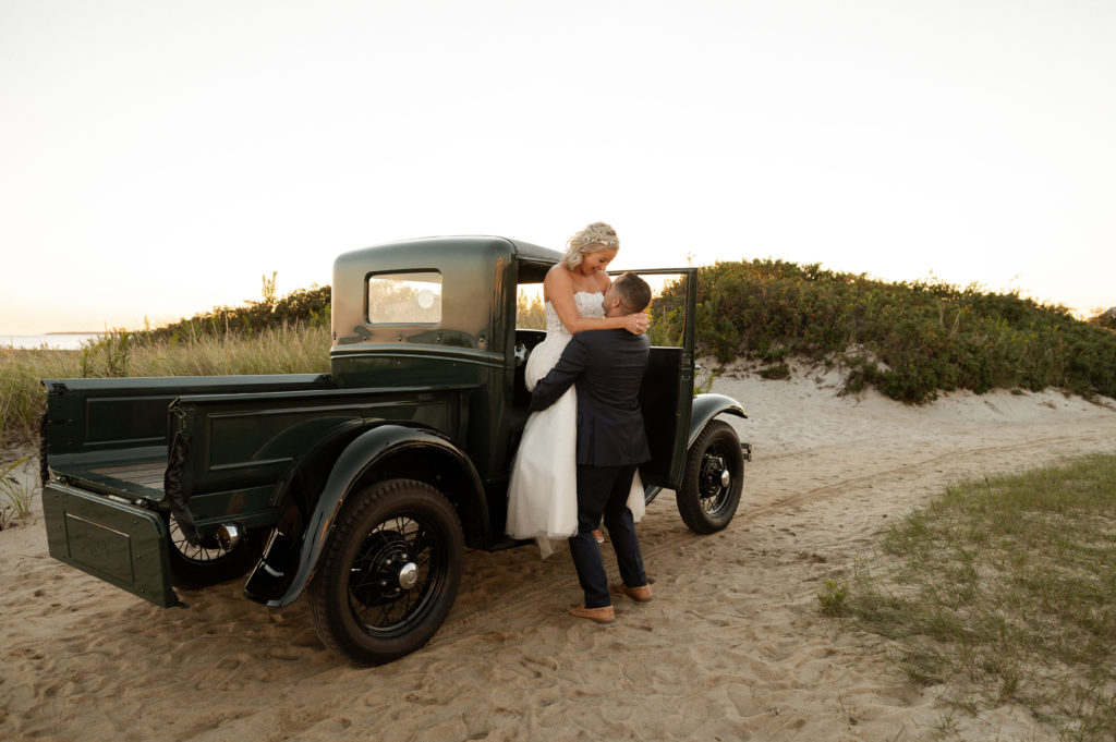 Bride and groom sunset portraits with vintage truck at the Lighthouse Inn Cape Cod