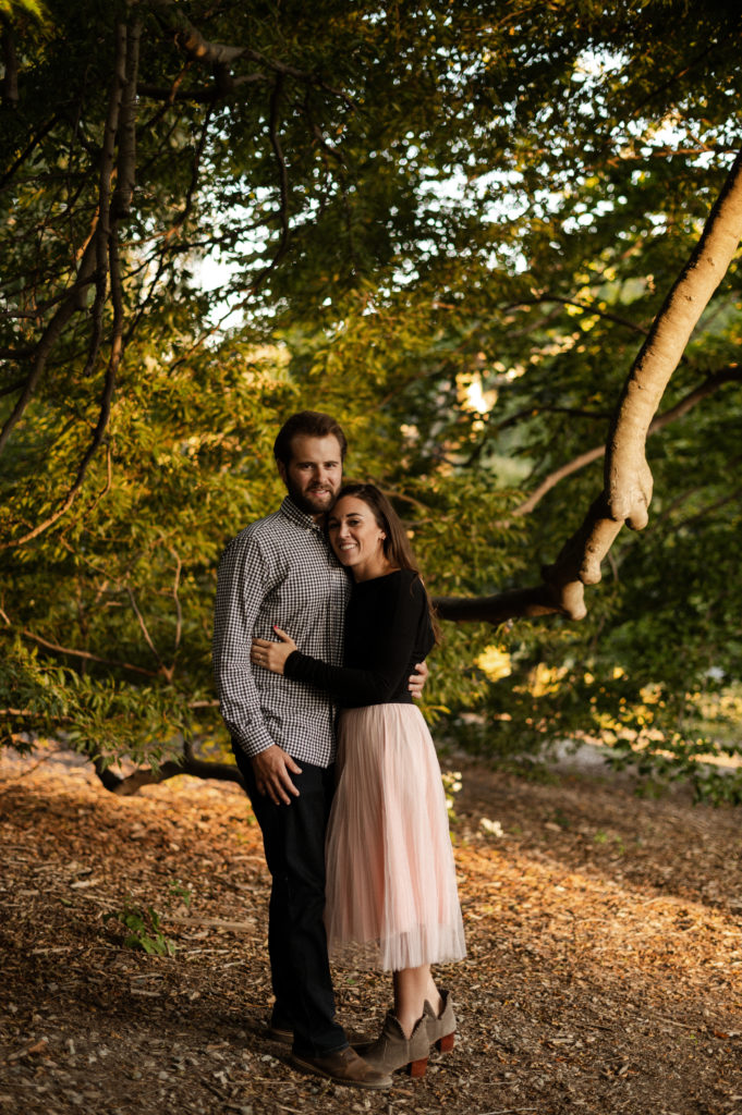 Cute couple together during their boston engagement session at the Arnold Arboretum