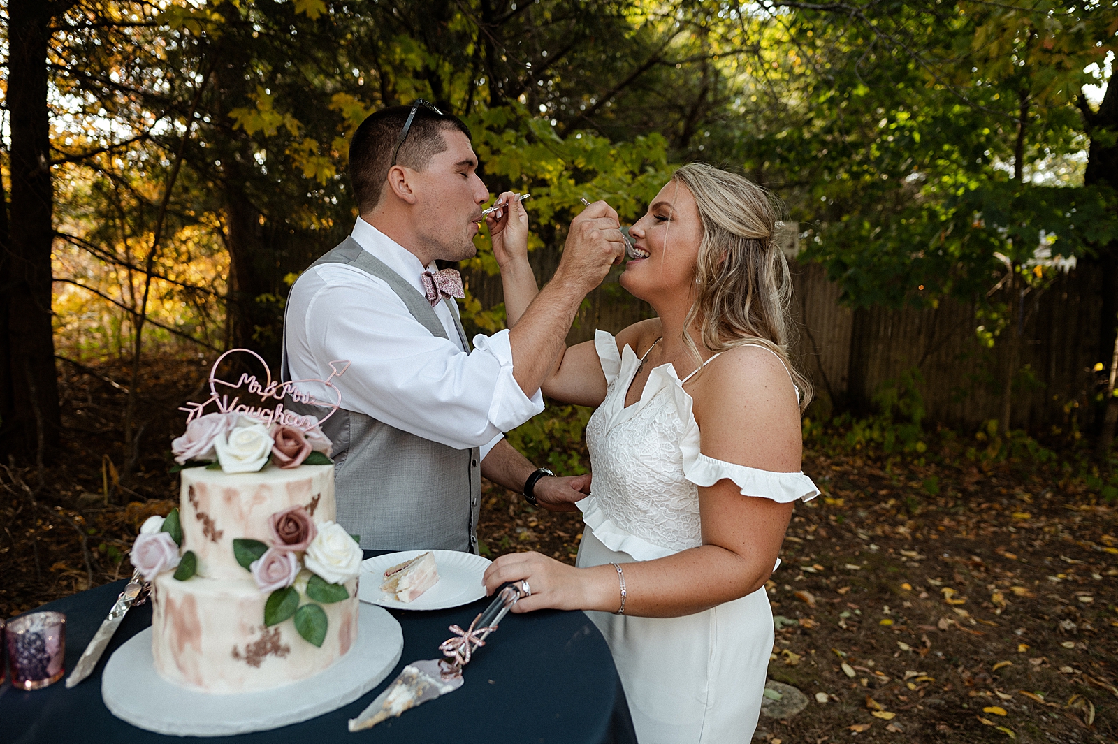 Bride and Groom exchanging cake bites to each other