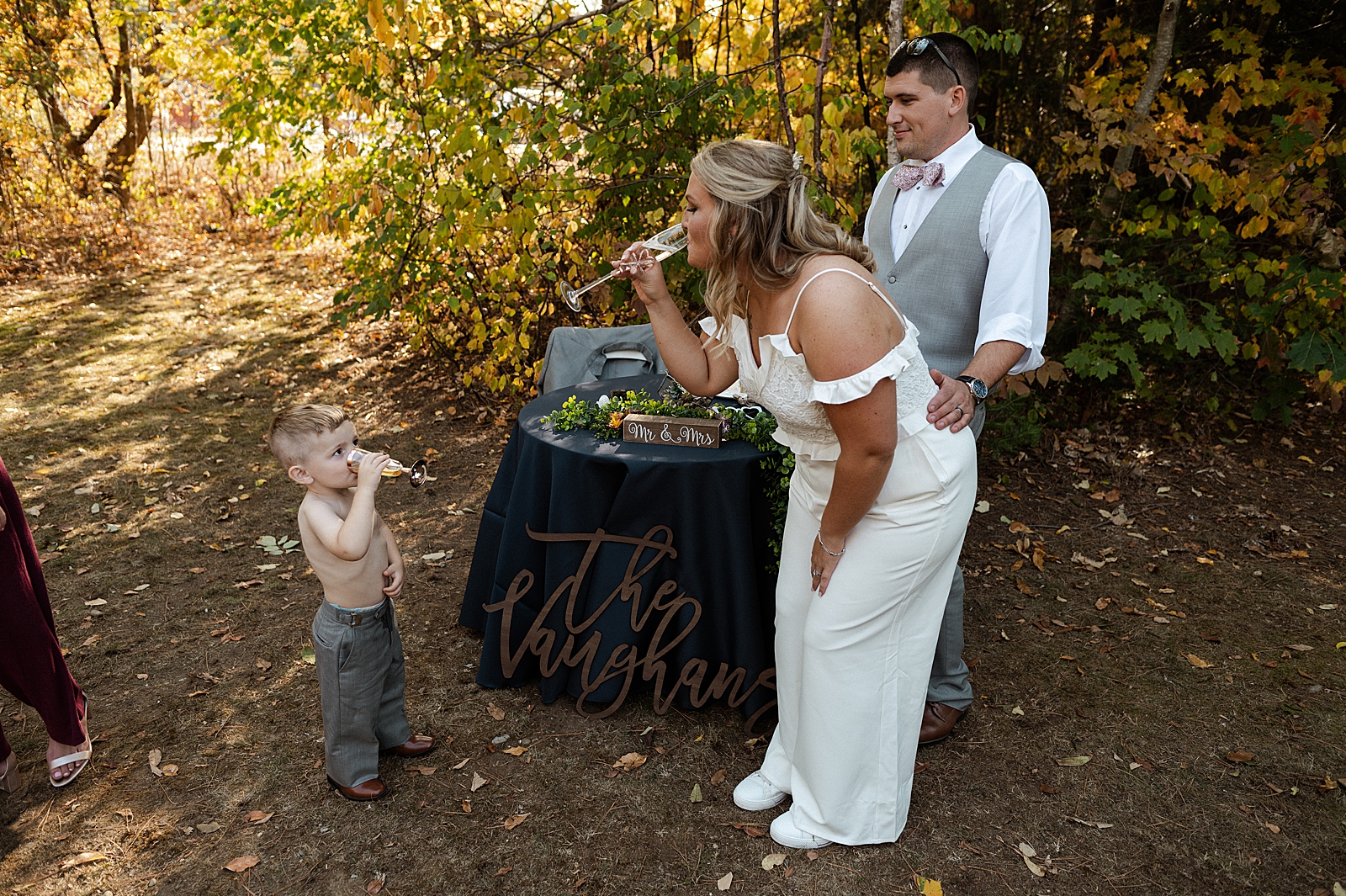 Bride cheering with ring bearer