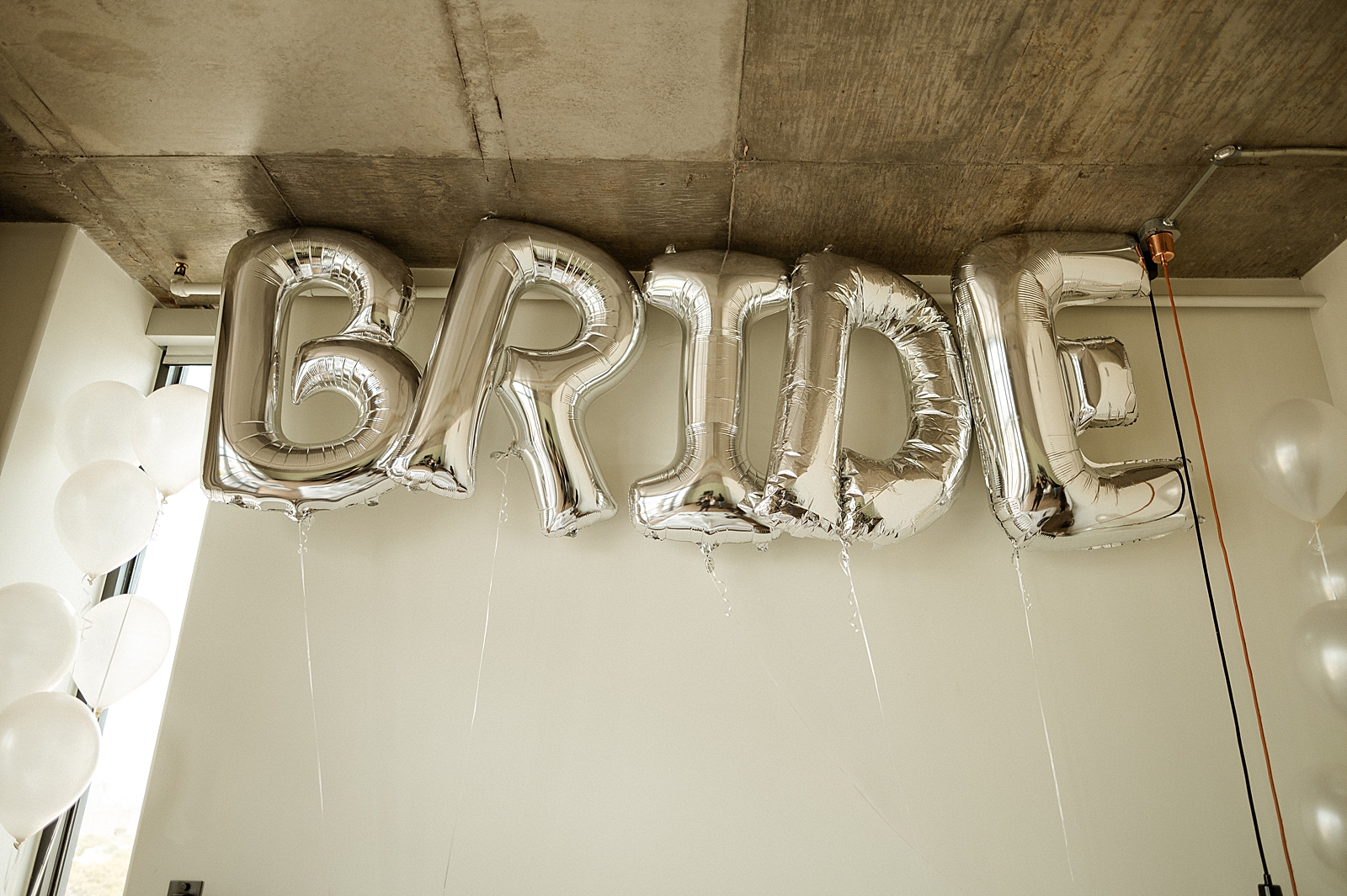 Detail shot of infltable "BRIDE" balloons