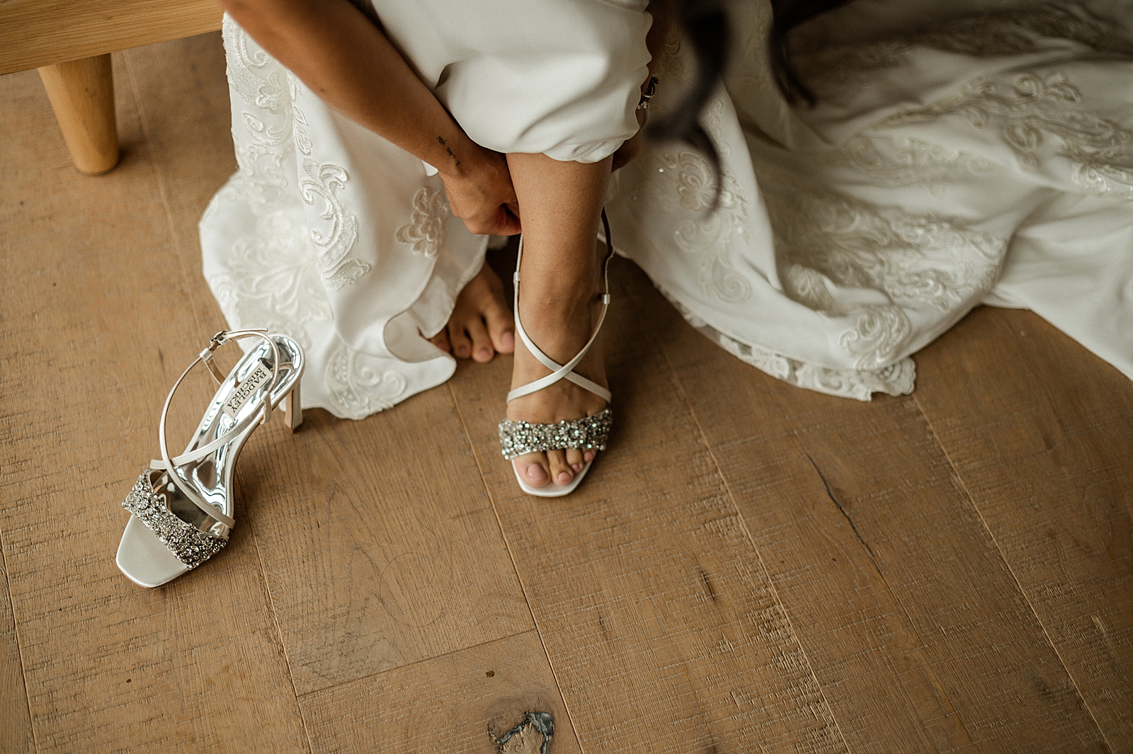 Closeup of Bride strapping on heels