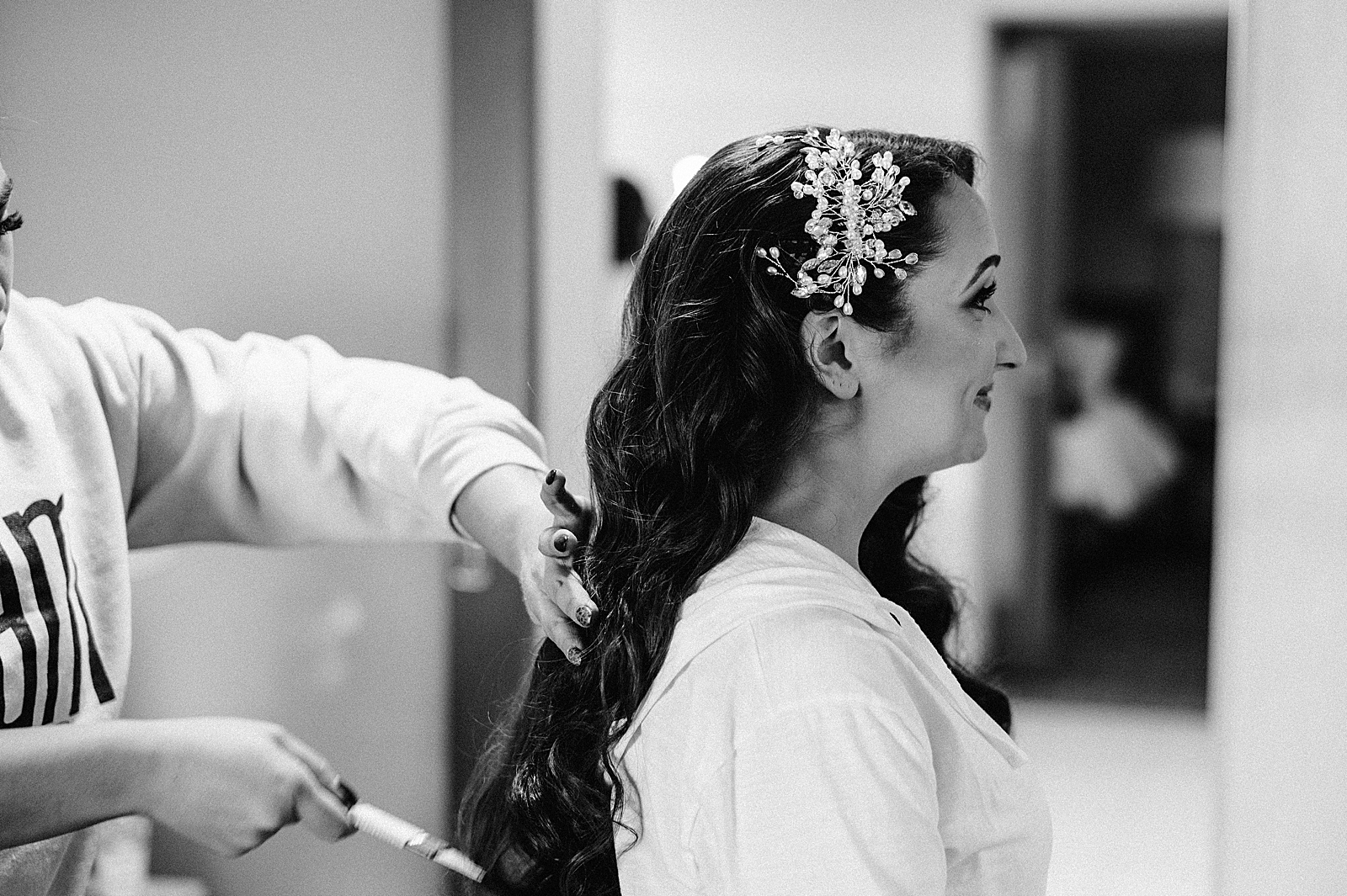 B&W Bride getting hair done by hairstylist