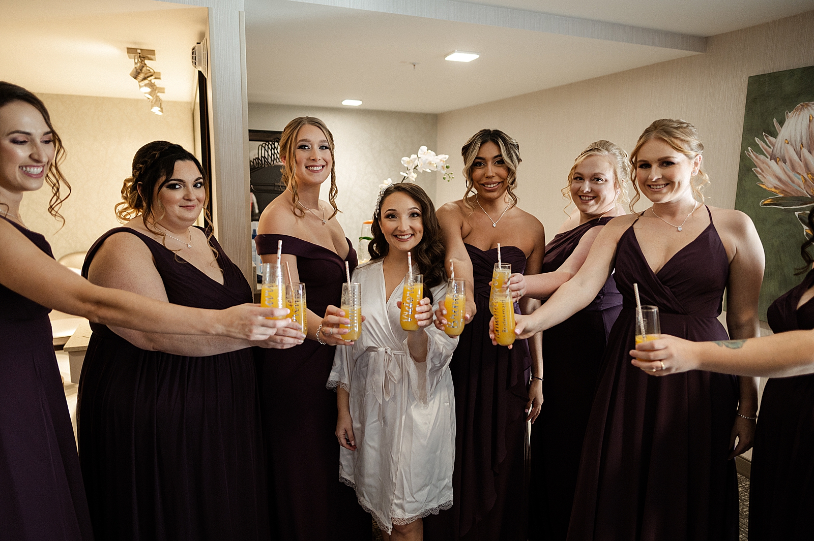 Bride and Bridesmaids with Champaign glasses before getting ready