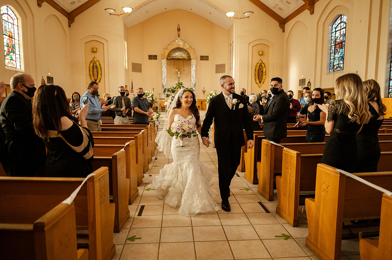 Bride and Groom walking down aisle together