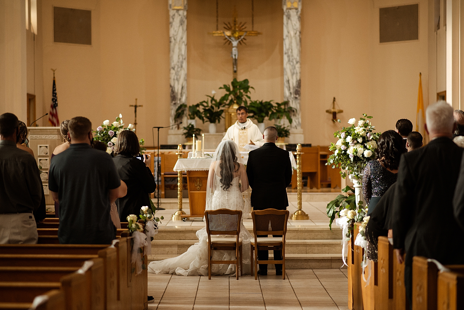 Bride and Groom standing side by side for Ceremony Homily
