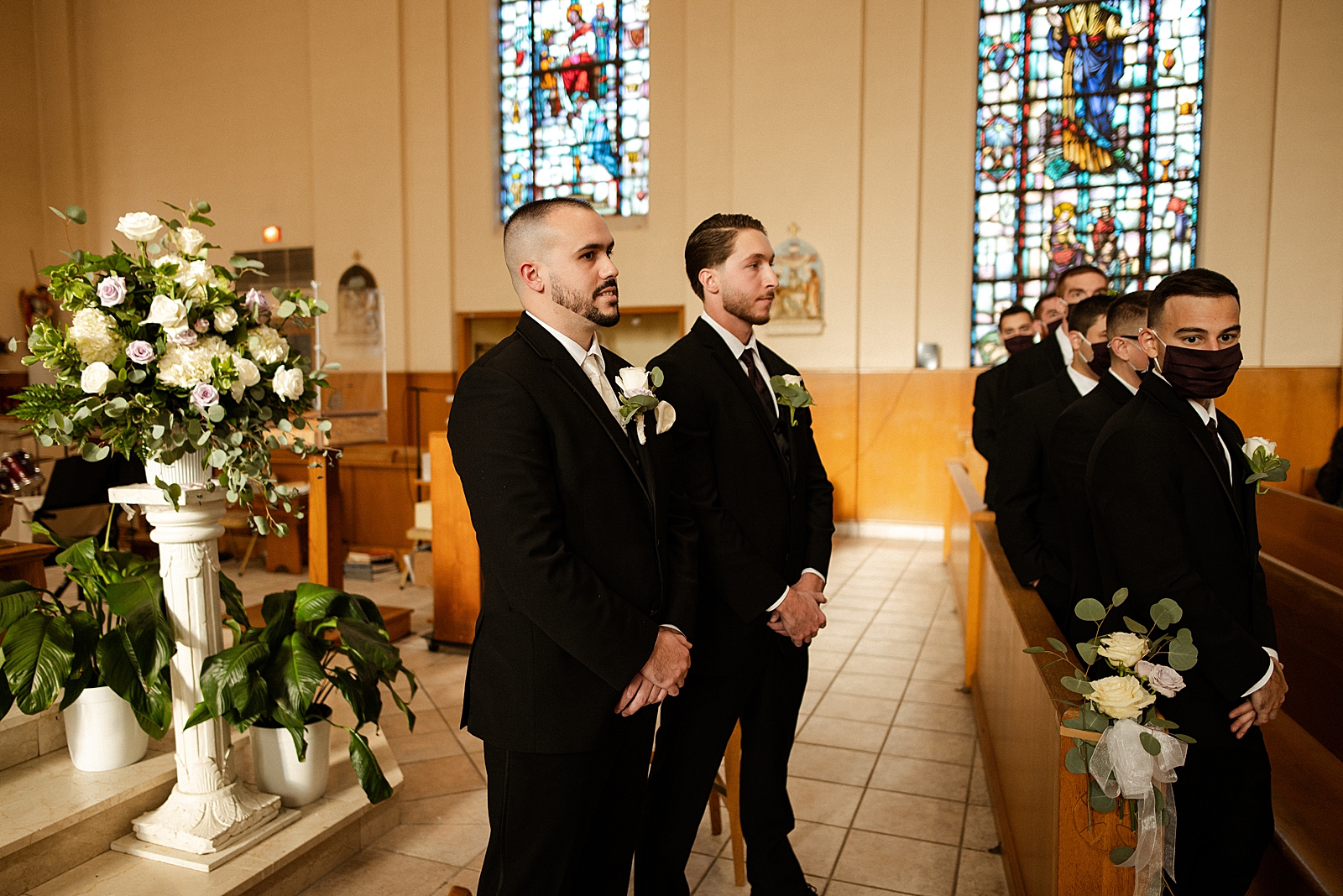 Closeup of Groon and Groomsmen standing in formal formation