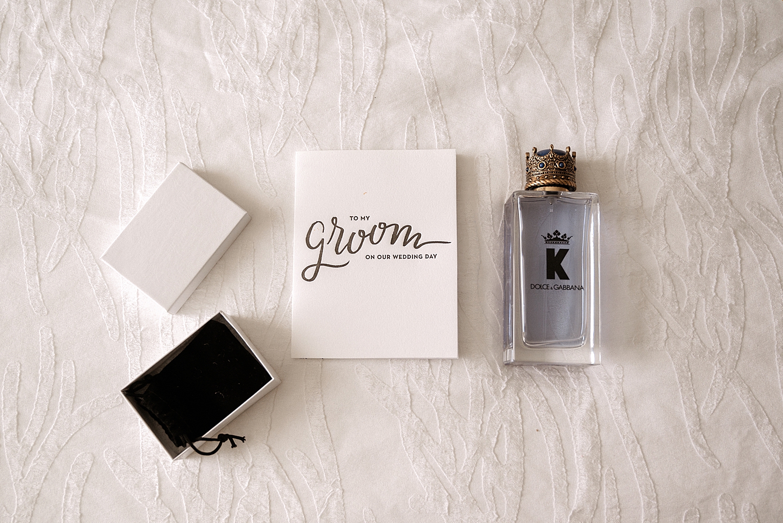 Detail shot of Groom's letter and cologne
