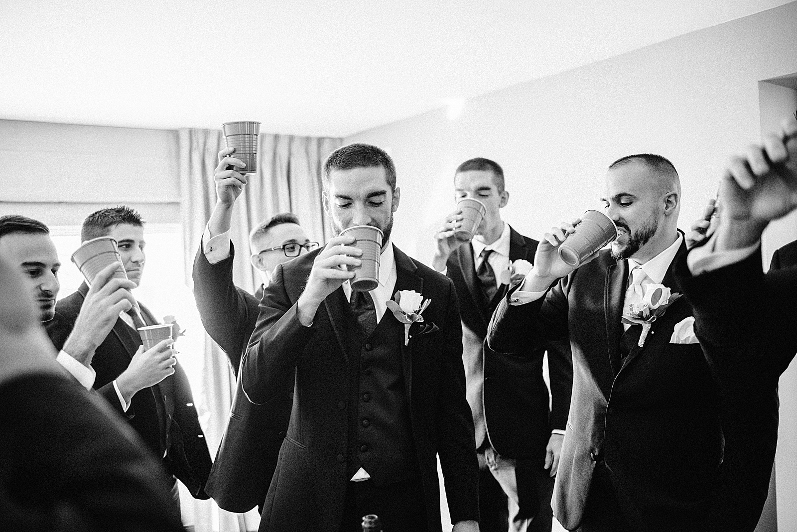 B&W Groom and Groomsmen drinking out of red solo cup