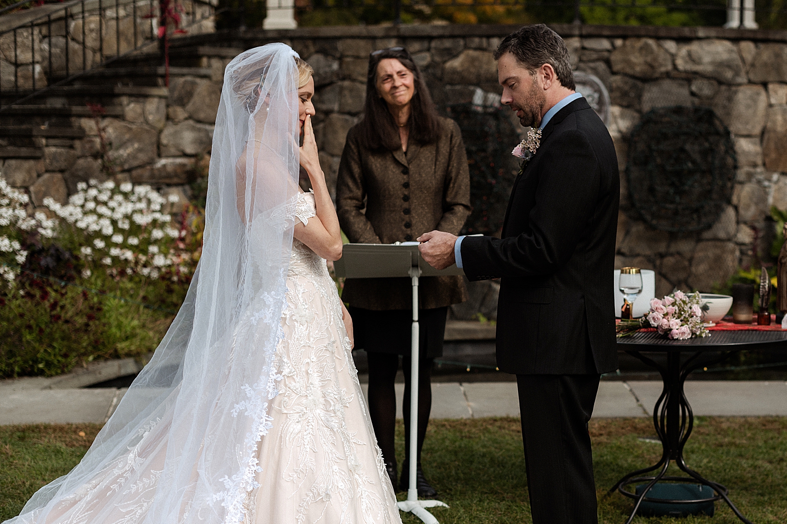 Groom giving vows to Bride outside in front of officiant Ceremony