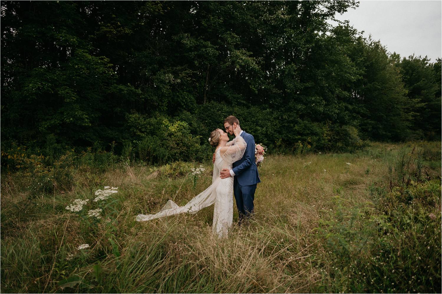 Bride and Groom portrait in Meadow at Red Barn at Hampshire College
