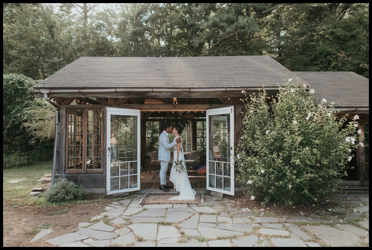 Bride and groom share kiss during their elopement at foxfire mountain house