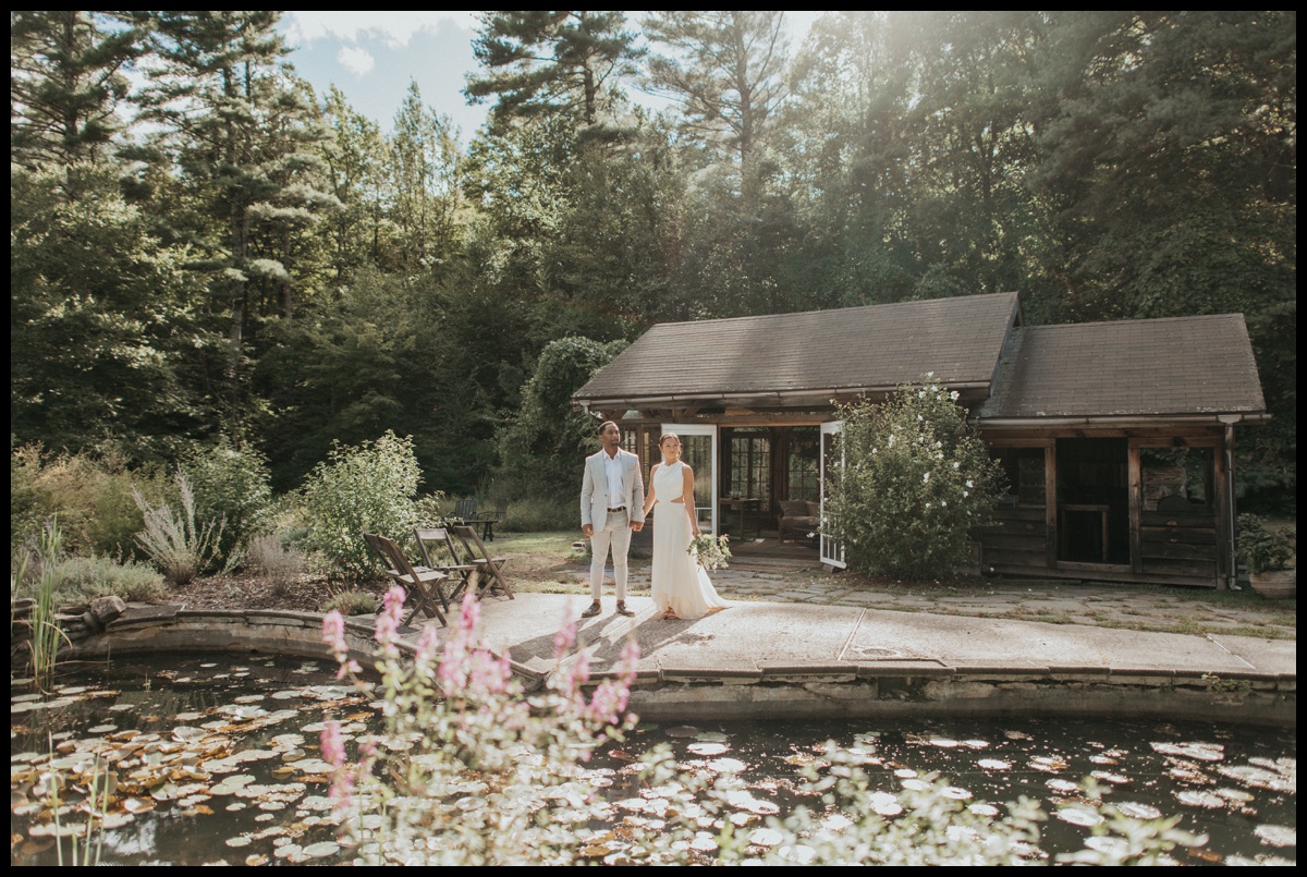 Bride and groom walking together in Catskills Elopement